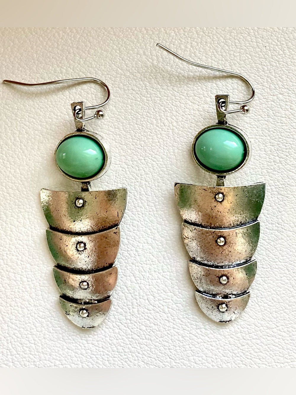 Green and silver earrings with a unique design